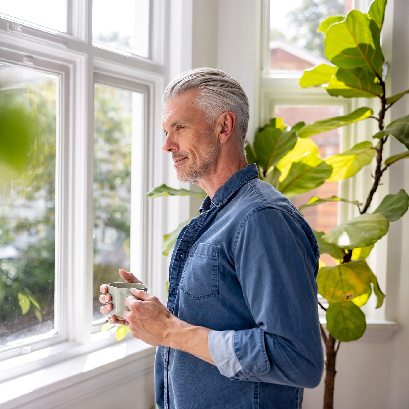 Man looking out the window