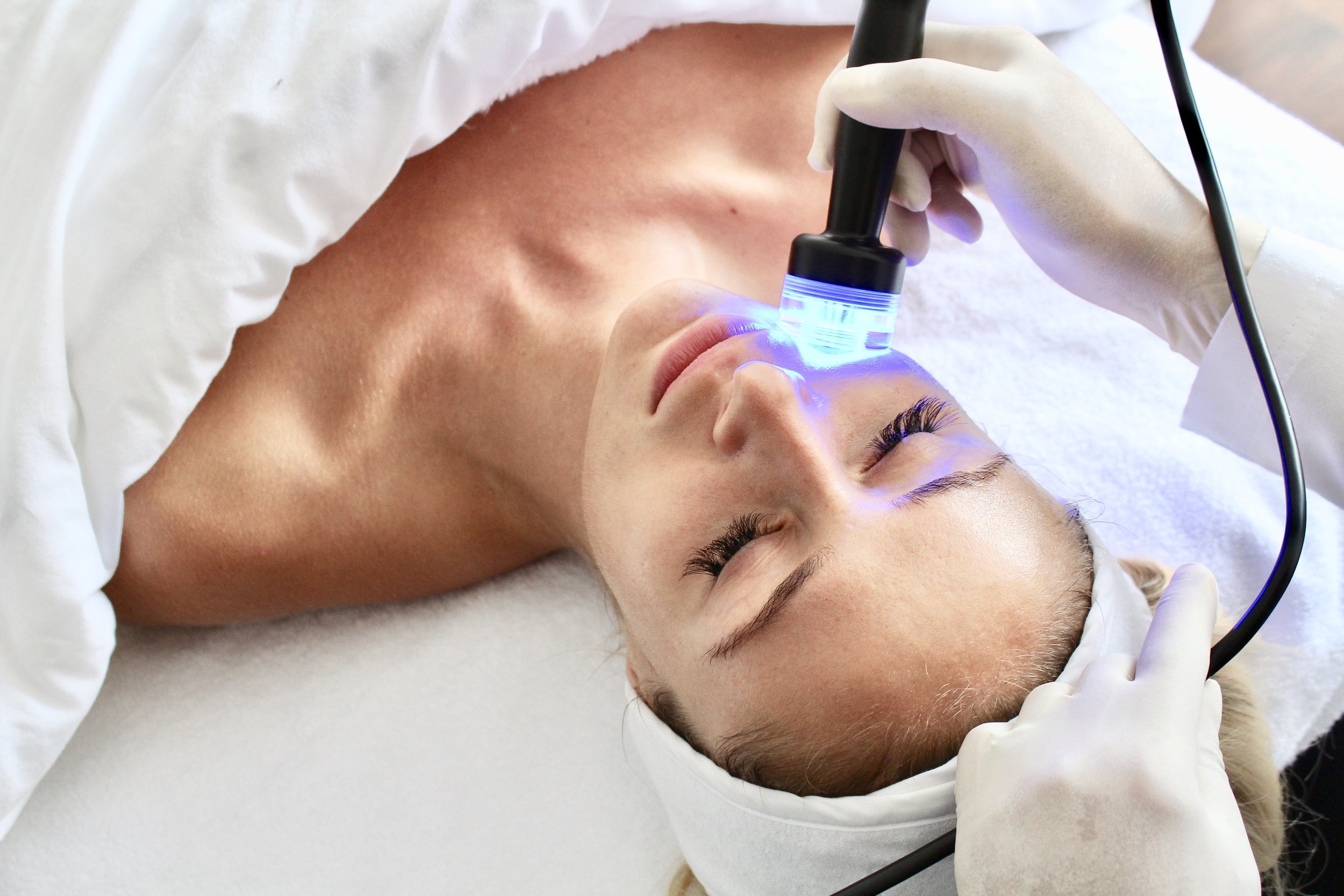 A woman getting the OxyLight Facial